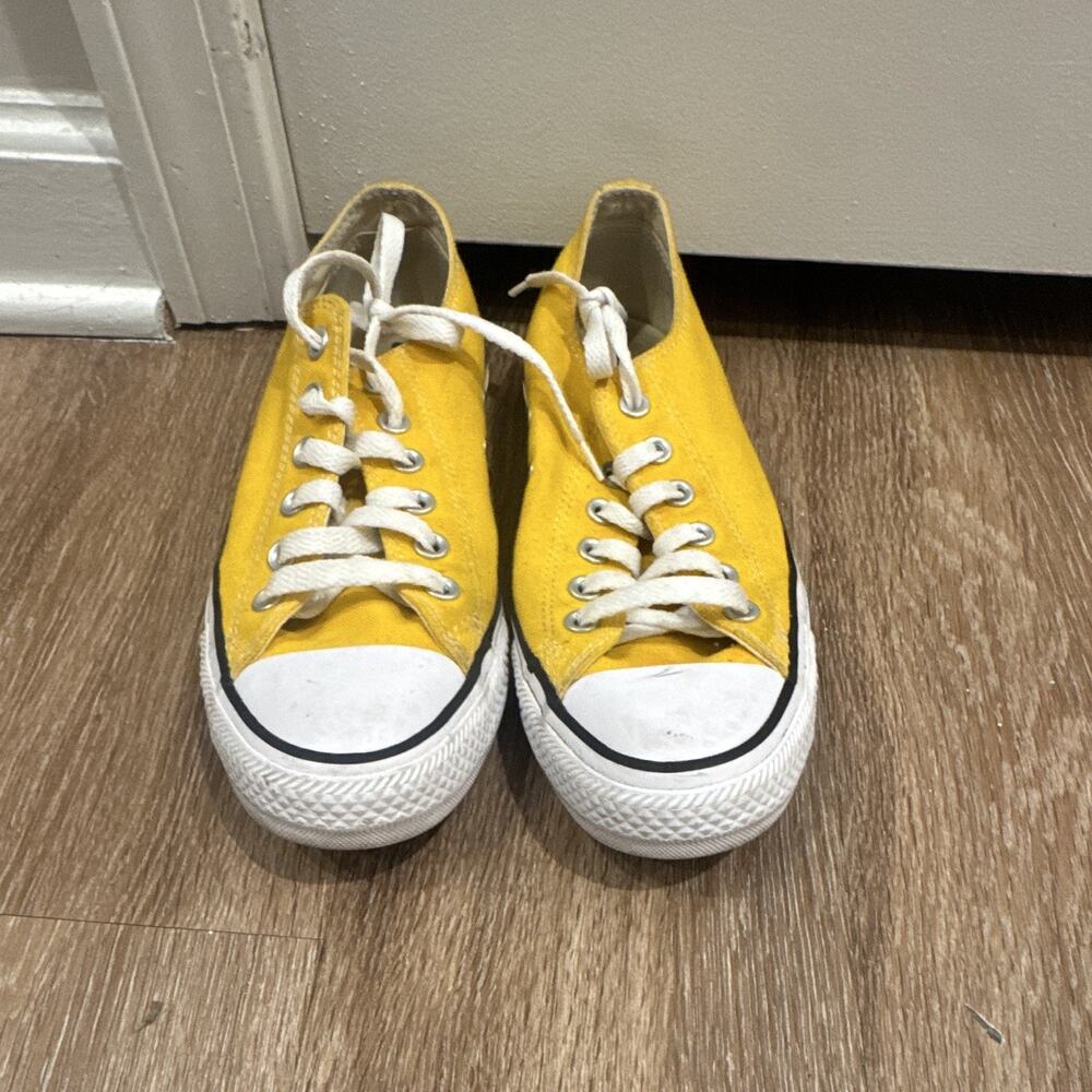 Bright yellow low-top Converse Chuck Taylor All Star canvas sneakers